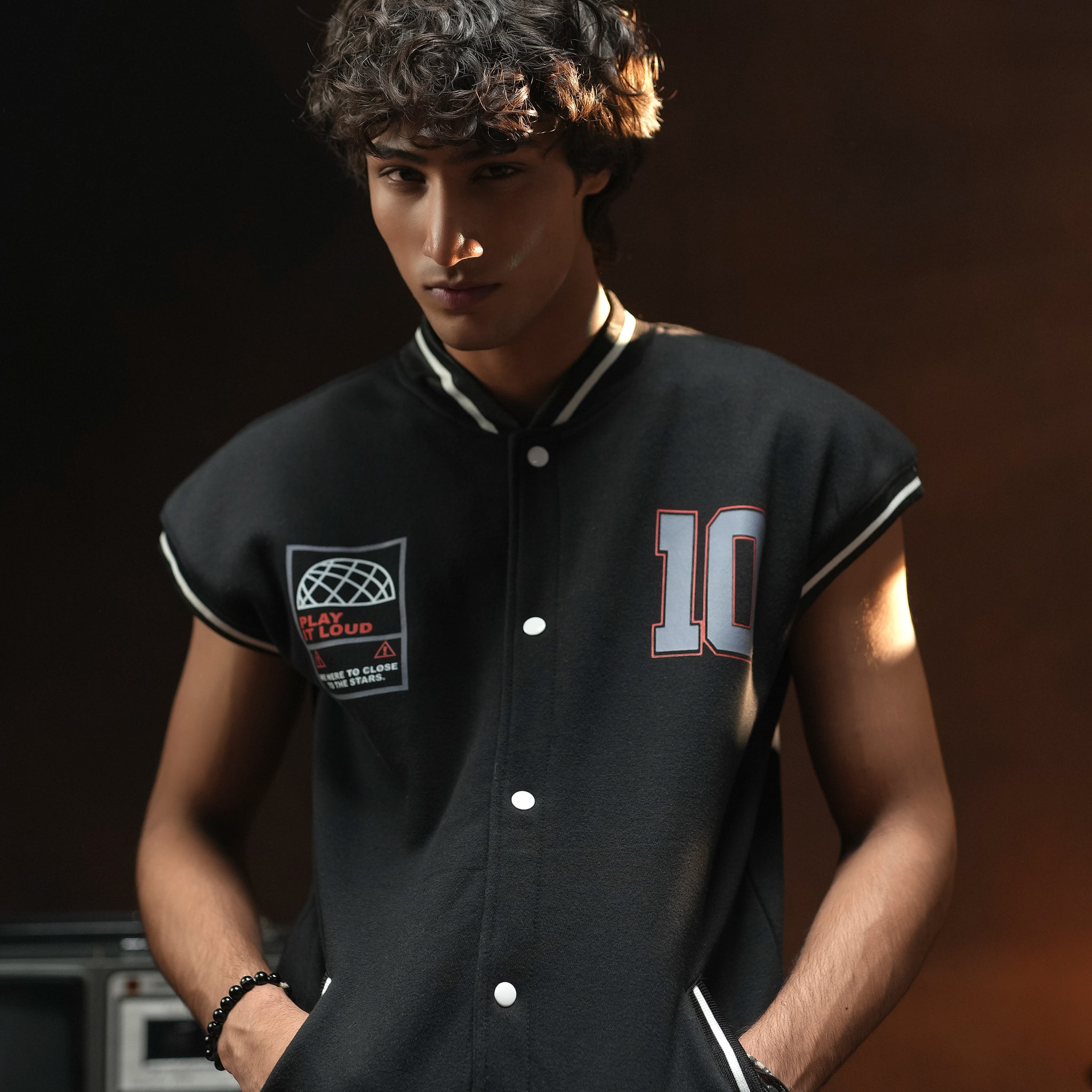 REBEL CODE SLEEVELESS VARSITY JACKET